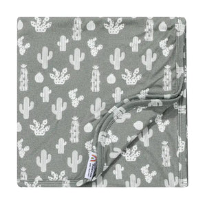 The Emerson and Friends Bamboo Blanket with Stay Sharp design is neatly folded, showing its gray color and cactus print.