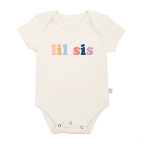 White Lil Sis Organic Bodysuit by Finn and Emma, made from eco-friendly dyes and organic cotton.