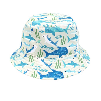 Emerson and Friends Reversible Bucket Hat, Shark Friends, features an underwater theme with a playful shark print. Adorned with blue and green whales, sharks, and seaweed on a white background, its ideal for babies and toddlers seeking style and protection.