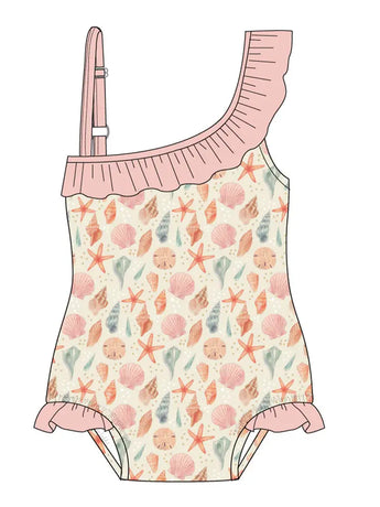 Emerson and Friends One Piece Swimsuit in Sandy Seashells print features a one-shoulder design with pink ruffled trim, seashells, starfish, and coral in pastels on a light background. Small ruffles accentuate the legs of this UV protective swimwear.