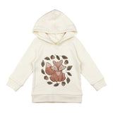 The Lovedbaby Organic Hoodie, Foxy, is cream-colored with an eco-friendly dye and features a fox illustration among leaves and acorns. Made from organic cotton with a hood and long sleeves, its ideal for nature lovers who value sustainable fashion.