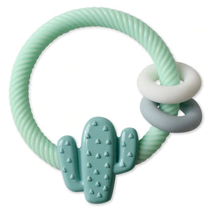 The Itzy Ritzy Itzy Rattle, Cactus, is a mint green teething ring shaped like a cactus with textured bumps to soothe gums. It includes two smooth rings—one white and one gray—in a twisted rope design, offering both comfort and entertainment for your little one.