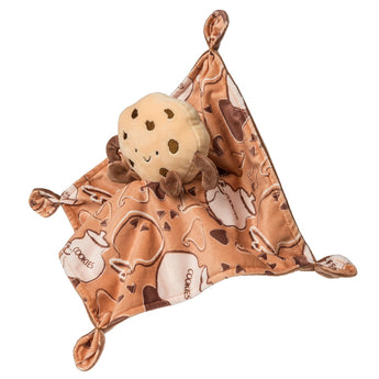 The Mary Meyer Sweet Soothie Blanket features a plush chocolate chip cookie character with an embroidered face. This brown blanket is adorned with cookie, teapot, and mug patterns and has charming knotted corners.