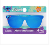 The Arkaid by Sunstaches sunglasses for kids feature a Stitch blue pattern from Disney, impact-resistant lenses, UV protection, playful packaging with a cartoon Stitch character, and safety information.