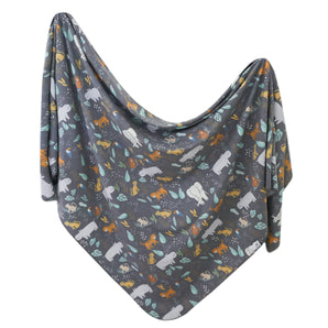 Knit Swaddle Blanket, Bengal by Copper Pearl: A gray baby blanket with colorful animal and leaf prints.