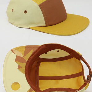 Storied Hats Lil Hat, Desert Sunset: yellow & brown cap with abstract brim patterns, adjustable strap, and quick-drying fabric.