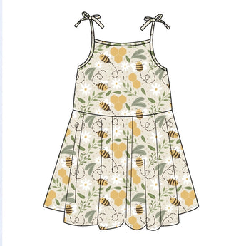 Illustration of Emerson and Friends Sundress in Happy Honey Bees pattern with green, white, gold tones and bow straps.