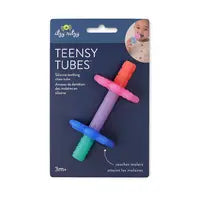 The Itzy Ritzy package for Teensy Tubes highlights their BPA-free silicone teething chew tubes in vibrant pink, purple, blue, and green. With a textured hollow design for enhanced relief, it shows an image of a baby using the product, suitable for ages 3 months and up.