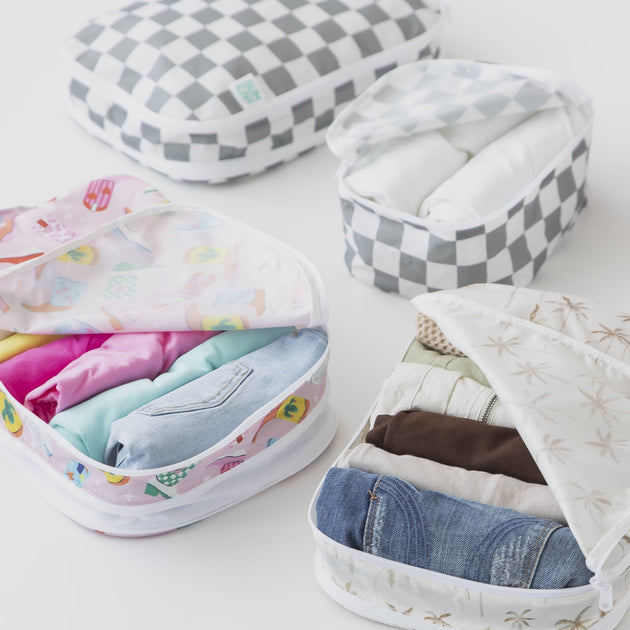 Bumkins Packing Cubes feature fun, colorful designs that never fade in its signature waterproof fabric, perfect for family travel.