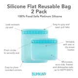 The Bumkins Silicone Flat Reusable Bag 2 Pack in blue is child-friendly, writable, and heat-safe with a zip seal.