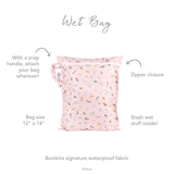 Bumkins Wet Bag: Princess Magic, pink Disney print, waterproof, reusable fabric; zipper closure with snap handle. Size: 12 x 14.