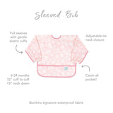 The Bumkins Sleeved Bib: Lace has a floral pattern, elastic cuffs, adjustable neck tie, and waterproof fabric. Perfect for ages 6-24 months.