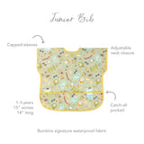 Bumkins Junior Bib: Camp Gear with capped sleeves, adjustable neck, catch-all pocket, and playful food & nature designs.