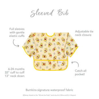 Bumkins Sleeved Bib: Winnie Loves Hunny features a playful yellow pattern, elastic cuffs, and a catch-all pocket. Perfect for weaning!.