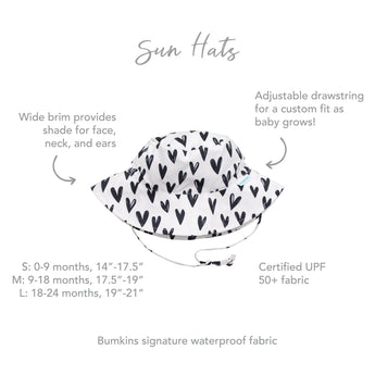 Bumkins Sun Hat: Hearts - White with black hearts, wide brim, adjustable drawstring. UPF 50+. Sizes 0-24 months.