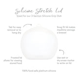 The Lavender Bumkins Silicone Grip Dish features a snug white silicone lid with frosted viewable surface and writable area.