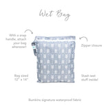 The Bumkins Wet Bag: Arrow features a gray design with white arrows, a zipper, and snap handle. Its 12x14 and made of waterproof fabric.