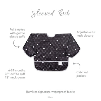 Bumkins Sleeved Bib: Mickey Mouse Icon Black + White features elastic cuffs, adjustable tie neck, and catch-all pocket for ages 6-24m. Waterproof.