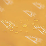 Water droplets on the yellow Sunshine fabric with white eye designs from Bumkins Reusable Snack Bag, Large 2-Pack.