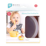 The Bumkins Silicone First Feeding Set: Clay packaging shows a child self-feeding with a yellow spoon and bowl, suitable from 4 months.