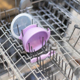 The Bumkins Lavender First Feeding Set includes a silicone bowl with lid and spoon; all dishwasher top-rack safe.