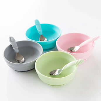 Bumkins Silicone Grip Bowls: Sage. Set of 4 with vibrant spoons, silicone grip, and strong suction bases arranged squarely.