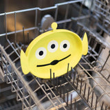 The Silicone Grip Dish from Bumkins, featuring the Toy Story Alien design, sits in the dishwasher rack. Perfect for toddler self-feeding.