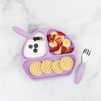 Bumkins Silicone Grip Dish: Lavender with yogurt, fruit, and waffles stays steady with a suction base. Pink utensils on the side.