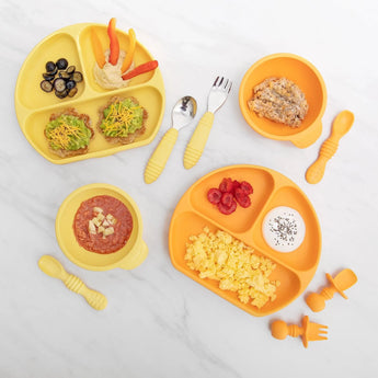 Bumkins Silicone Grip Dish: Pineapple offers toddler-sized portions of fruits, veggies, and eggs on a yellow sippy cup-friendly plate.