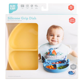 Packaging of a Bumkins Silicone Grip Dish: Pineapple, featuring a smiling baby in a dinosaur bib, showcasing toddler portions.