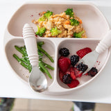 The Bumkins Silicone Grip Dish: Sand with a suction base holds couscous, broccoli, green beans, berries alongside a spoon and fork.