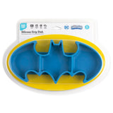 Silicone Grip Dish: Batman Blue by Bumkins is a toddler-safe, blue bat-shaped silicone plate with Batman logos on a yellow background.