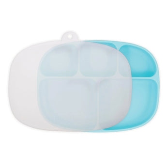 Two Silicone Grip Dishes by Bumkins in food-safe silicone, blue and translucent white, showcased on a pristine white background.