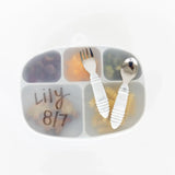 A Bumkins Silicone Grip Dish with Lid, Marble 5-section, labeled Lily 8/7 holds food with a fork and spoon on top.