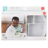 Child enjoying a meal from Bumkins Silicone Grip Dish with Lid (5 Section): Marble, featuring suction base and leak-resistant lid.