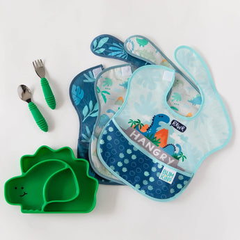 Bumkins Ultimate Gift Set - Dinosaurs & Blue Tropic: Dinosaur print bibs, green Silicone Grip Dish, and self-feeding Chewtensils.