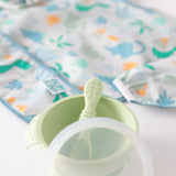 Bumkins Ultimate Gift Set: Blue Tropic bowl & spoon on a dino bib for independent eaters.