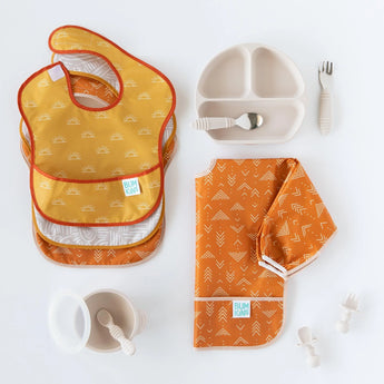 Bumkins Ultimate Gift Bundle in Desert Boho: Silicone Grip Dish, orange & yellow SuperBibs, orange smock, sippy cup, utensils.