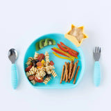 Childrens meal on a blue Bumkins Silicone Grip Plate with pasta salad, kiwi, peppers, pretzels, hummus star, and blue utensils.