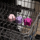 Bumkins Little Dipper 3-Pack: Lollipop, features star-shaped silicone covers for dishwasher rack prongs in pink, purple, and magenta.