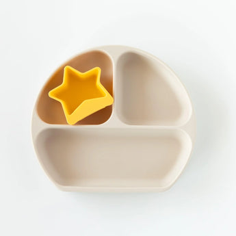 Bumkins Silicone Little Dipper: Tutti-Frutti features a beige divided plate with a yellow star-shaped cup in the top left section.