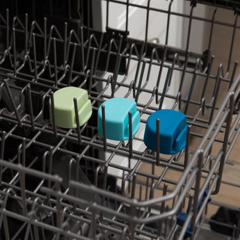 The Bumkins Silicone Little Dipper Round 3-Pack: Gumdrop set sits in the top rack of an open dishwasher.