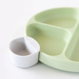 Bumkins Silicone Little Dipper Round 3-Pack in Taffy: Green plate with a white cup made from reusable food-grade silicone.