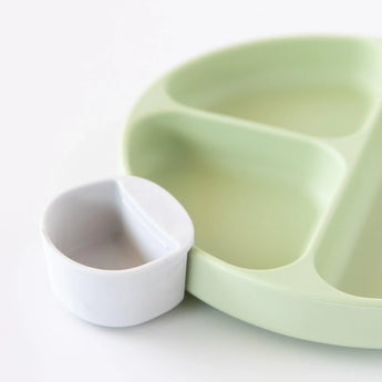 Bumkins Silicone Little Dipper Round 3-Pack in Taffy: Green plate with a white cup made from reusable food-grade silicone.