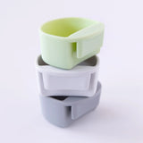 The Bumkins Silicone Little Dipper Round 3-Pack: Taffy in green, white, and gray are stacked vertically on a white background.