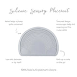 Bumkins Silicone Sensory Placemat in gray with a rainbow design offers a raised edge, textured nonslip surface, and easy travel flexibility.