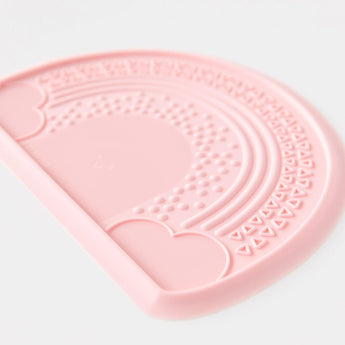 The Bumkins Silicone Sensory Placemat: Pink features curves and triangles, ideal for sensory play on a clean, white background.