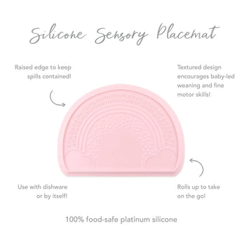 Bumkins Silicone Sensory Placemat: Pink with rainbow design, raised edge for spills, and roll-up feature for play and portability.