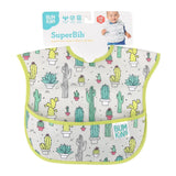 The Bumkins SuperBib®: Cacti features a cactus print, green trim, and packaging with a smiling baby. Its easy to wipe and suits ages 6-24 months.