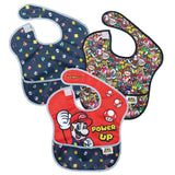 A 3-pack of Bumkins SuperBib®: Super Mario™ Power-Up features vibrant patterns, Power Up text, mushrooms, and stars on easy-wipe fabric.